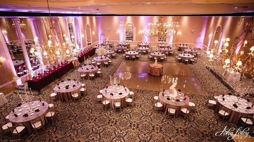 Spacious wedding banquet hall set up for a reception.